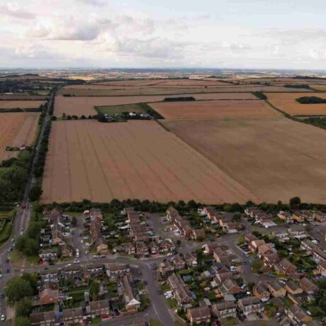 Aerial view capturing picturesque countryside and croplands at day