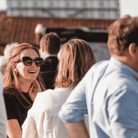 Image of women laughing and having a conversation